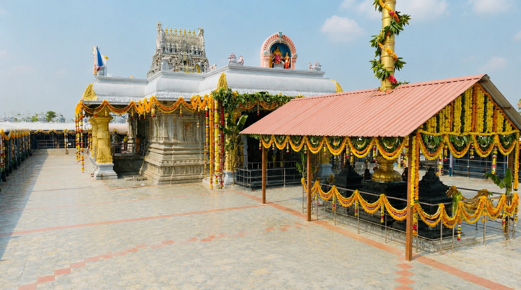 Decorated temple courtyard and shrine at Mangalapuri Kshetram